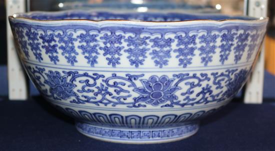 An unusual large Japanese Arita blue and white Kakiemon style bowl, Qianlong mark, 19th century, 30cm, hairline crack